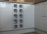 Wine rack and cupboards in high gloss white